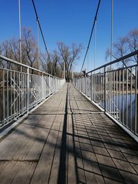 Suspended, narrow bridge over the river