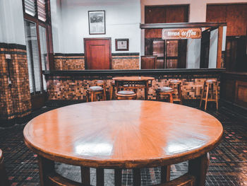 Empty chairs and table in restaurant