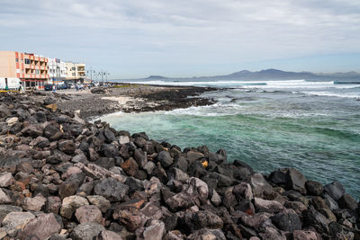 Scenic view of sea against cloudy sky