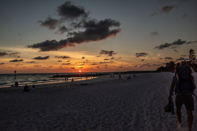 Scenic view of beach against sky during sunset