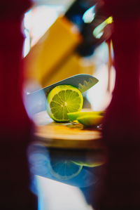 Close-up of a chef cutting a lemon with a sharp knife