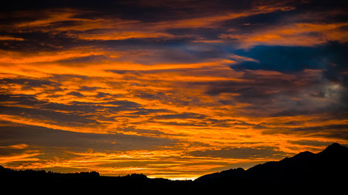 Low angle view of dramatic sky during sunset