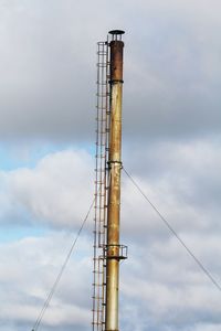 Low angle view of crane against sky