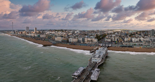 Aerial view of brighton palace pier, with the seafront behind.
