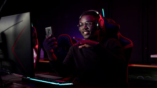 Young man using smart phone during video call