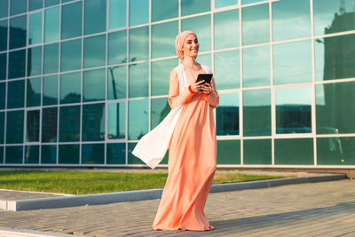 Young woman standing outdoors