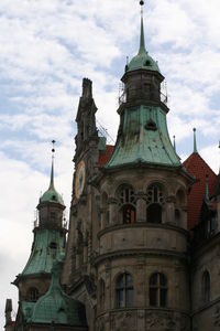 Statue of building against cloudy sky