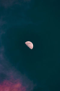 Low angle view of moon against sky at night