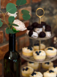 Close-up of wine glass with bottles