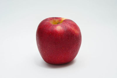 Close-up of apple against white background