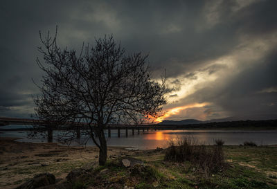 Scenic view of lake against sky during sunset