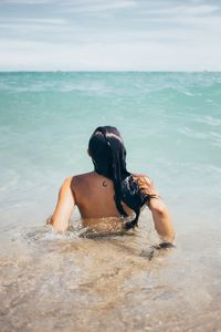 Woman swims in water