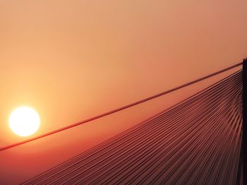 Low angle view of bridge against sky during sunset