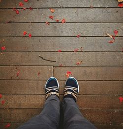 Low section of person standing on footpath