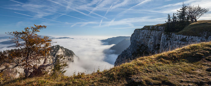 Scenic view of creux du van against sky