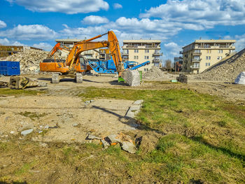 Construction site with an excavator on the territory. dismantling the building