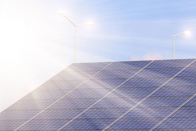 Solar panels against sky during sunny day