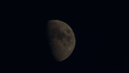 Low angle view of moon against sky at night