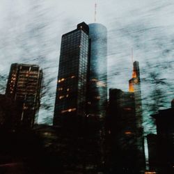 Low angle view of modern buildings against sky