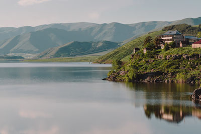 Scenic view of lake and mountains against sky
