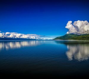 Scenic view of lake against blue sky