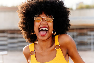 Portrait of young woman wearing sunglasses