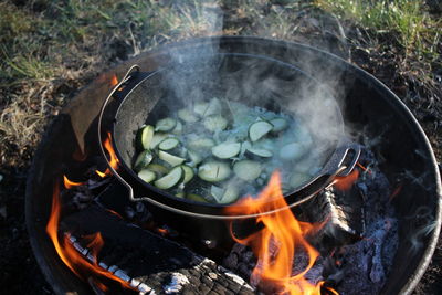 High angle view of bonfire on barbecue grill
