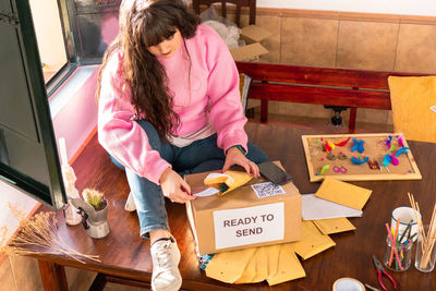 High angle view of woman working at home