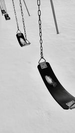 High-angle view of swings in show covered park