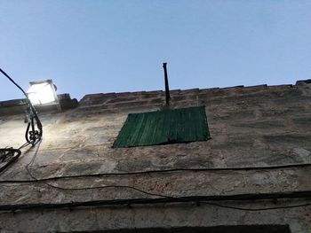 Low angle view of brick wall