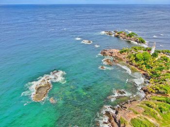 High angle view of rocks on sea