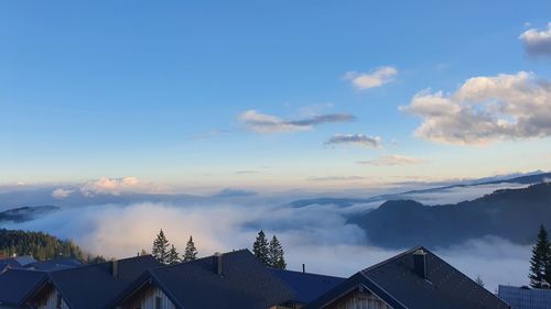 High section of houses and buildings against sky during sunset