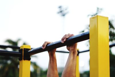 Low angle view of child on slide in playground