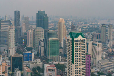 High angle view of buildings in city against sky