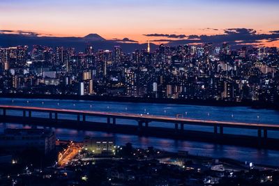 High angle view of illuminated buildings in city at night