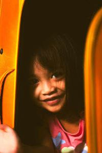 Close-up portrait of a smiling young woman