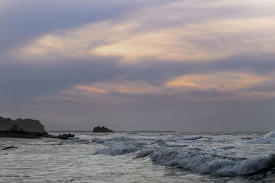 Scenic view of sea against sky at sunset