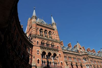 Low angle view of historical building against blue sky