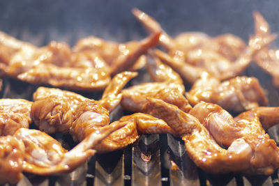 Close-up of meat on barbecue grill