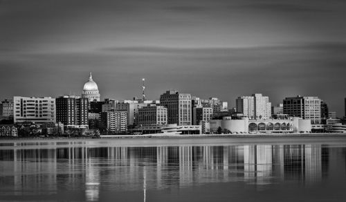 City at waterfront against sky