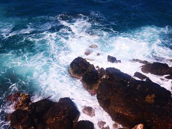 Waves splashing on rocks