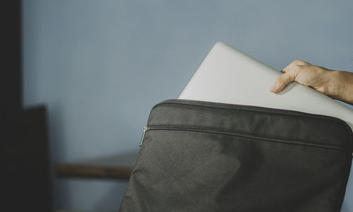 Cropped hand of woman reading book