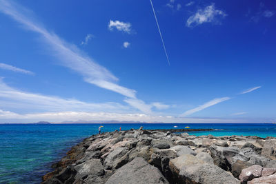 Scenic view of sea against blue sky