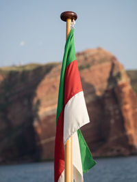 Close-up of multi colored flag against the sky