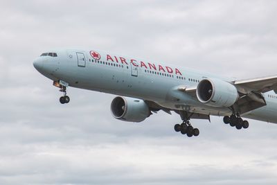 Low angle view of airplane against sky