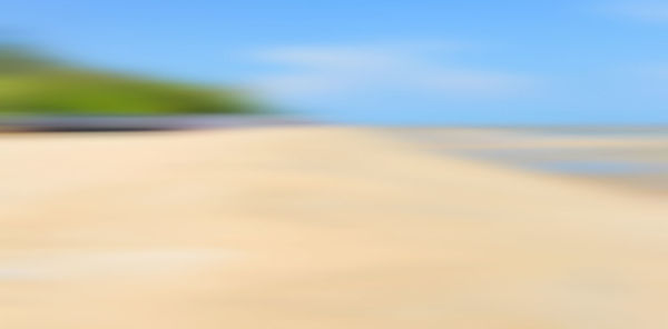 Scenic view of sand dunes against sky