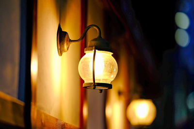 Close-up of illuminated light outside at night.