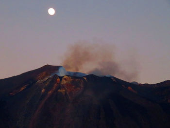 Scenic view of mountains against sky at night