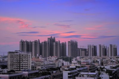 Cityscape against sky during sunset 