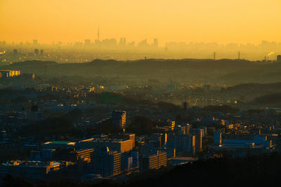 High angle view of buildings against sky during sunset